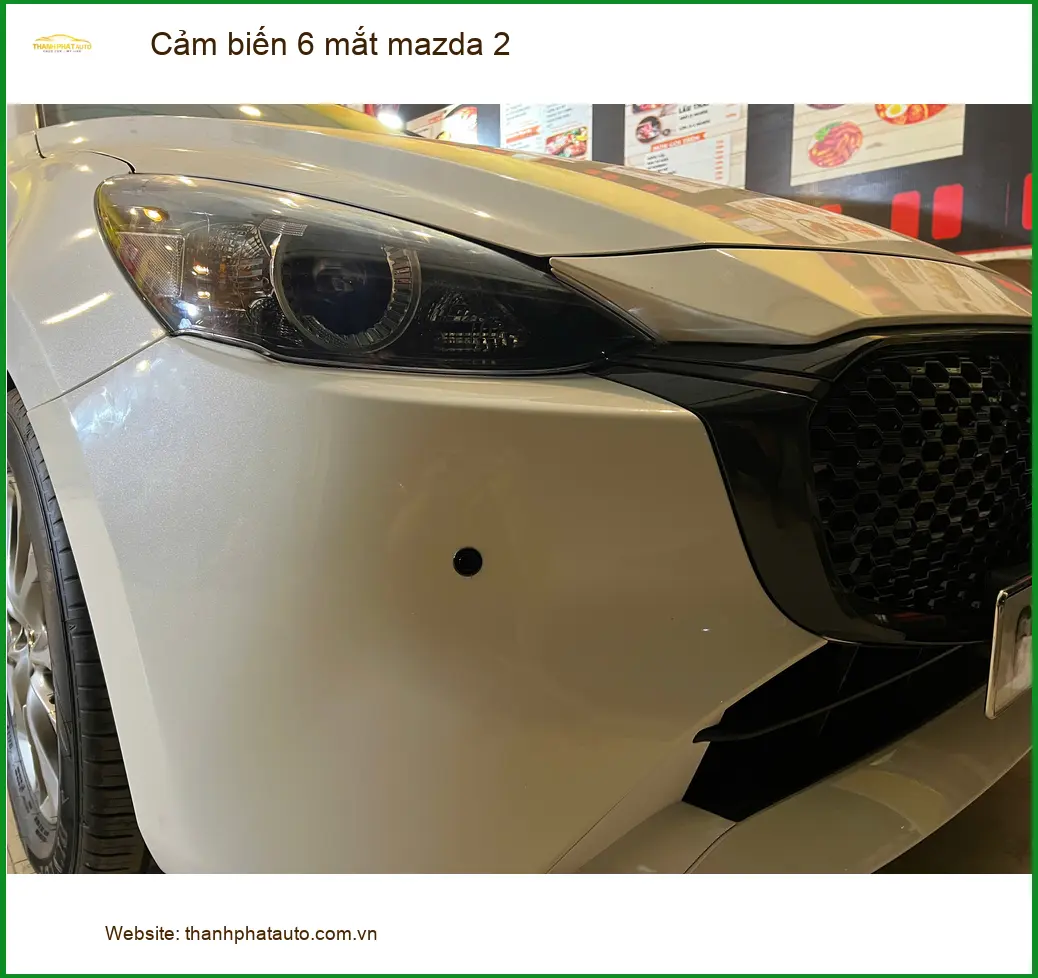 Chị Diệu lắp cảm biến 6 mắt Mazda 2 để tránh va chạm khi lùi xe tại Quận Bình Thạnh